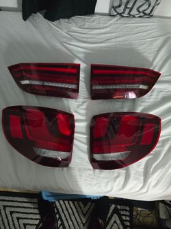 Set of 4 Red Car Tail Lights Replacement Parts for a bmw x5.