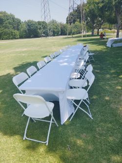 Chairs fringe umbrellas tables
