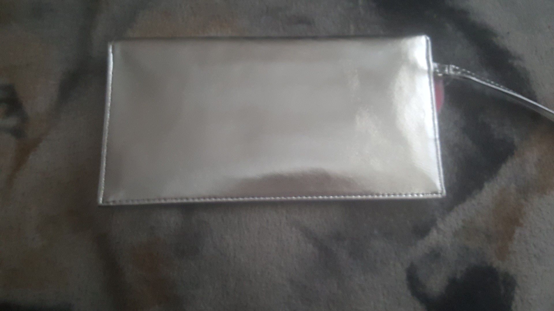 Shiny silver envelope clutch