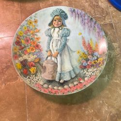 This vintage collector's plate is from the 1979 "Mother Goose" series, featuring the artwork "Mary, Mary" by artist John McClelland.     