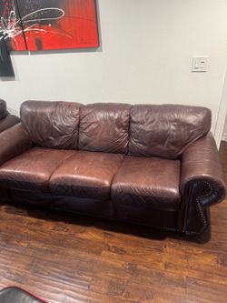 Living room brown real leather sofa has a rip as you can see in the picture