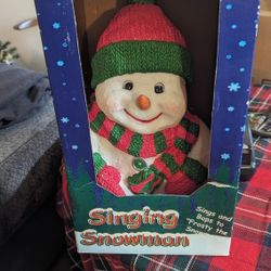 NEW IN THE BOX SINGING SNOWMAN. MAKE OFFER 