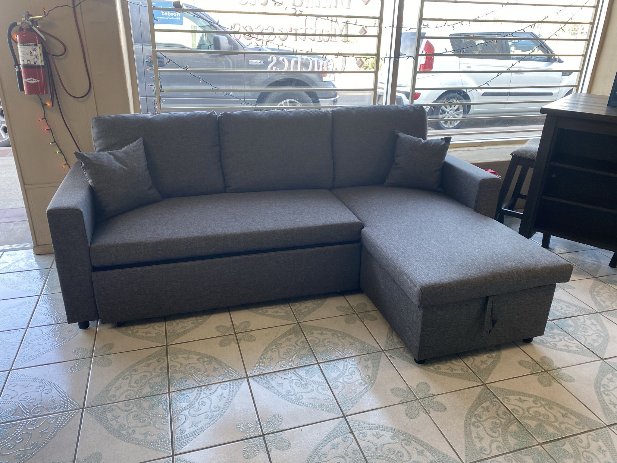 Grey Reversible Sectional With Pull Out Bed 