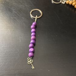 Wood Purple Beads With A Key Charm Keychain