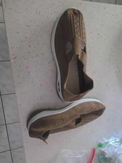 2 Brand new woman shoes one is green and onenis brown and very comfortable. Size 8.5