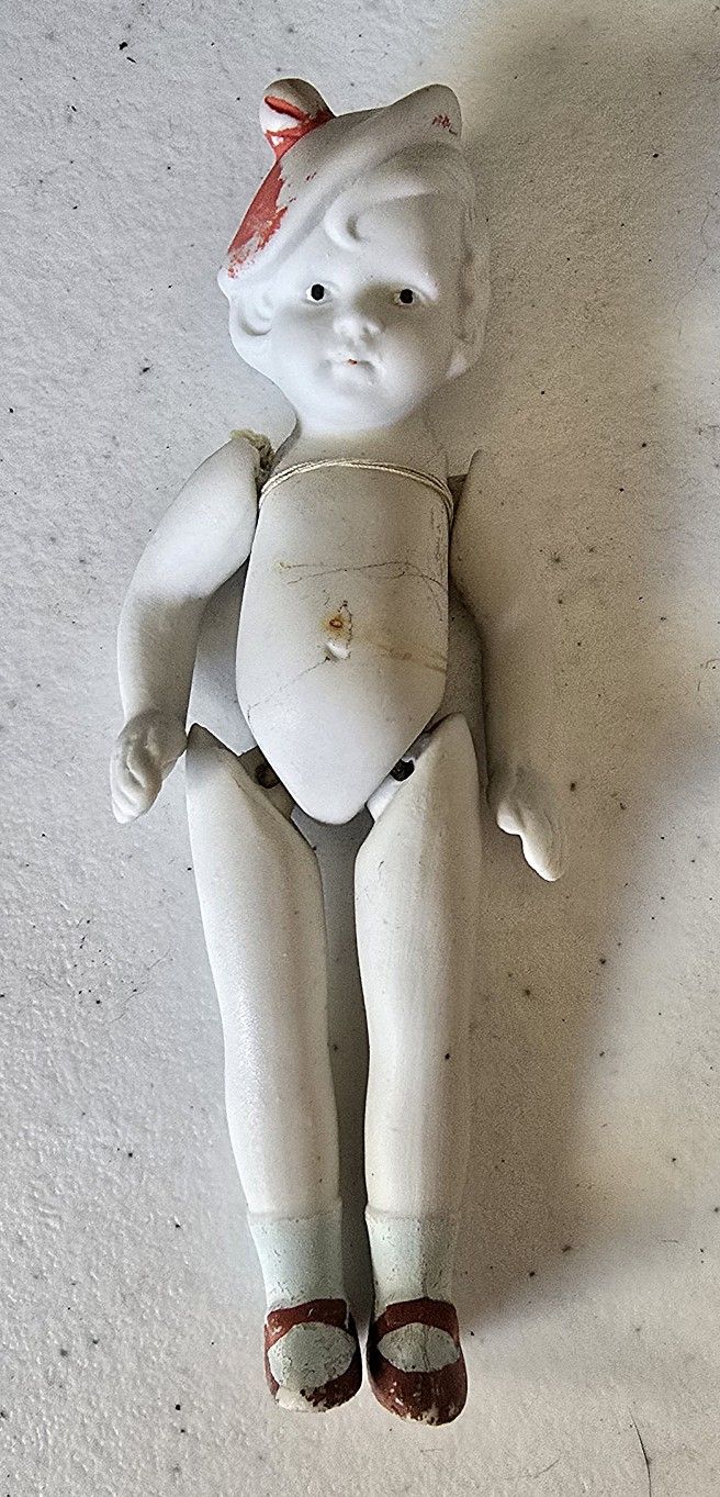 VTG Hinged bisque doll with red beret
