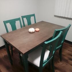 Like New Wood Retangle Table And 4 Chairs(Brown Wood Top And Teal Blue Legs And Chairs With Padded Cream Seats) Make An Offer 