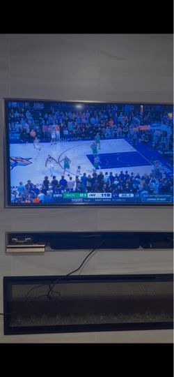 Large Flat Screen Wall-Mounted TV