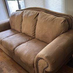 Lovely brown sofa with detail.