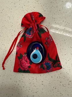Traditional Turkish glass evil eye protection charm with pouch
