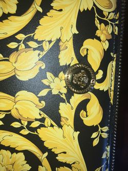 Black and gold unisex versace bag 