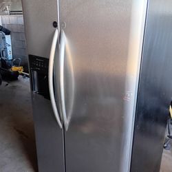 A Double Door Refrigerator And Fridge With Ice Maker
