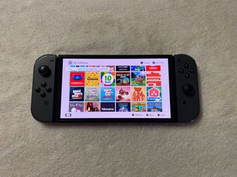 Nintendo Switch OLED + 100 SWITCH GAMES and 7500 Classic Games
