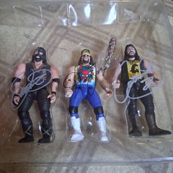 Mick Foleys triple threat action figures (signed)