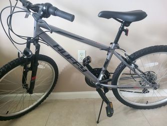 Huffy Rock Creek Mountain Bike with 24-inch wheels and a gray frame.