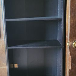 Tall Black Shelf In Good Condition some shelves are adjustable.  has some mirrors on side. 