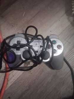 silver Sony PlayStation 2 DualShock 2 analog controller