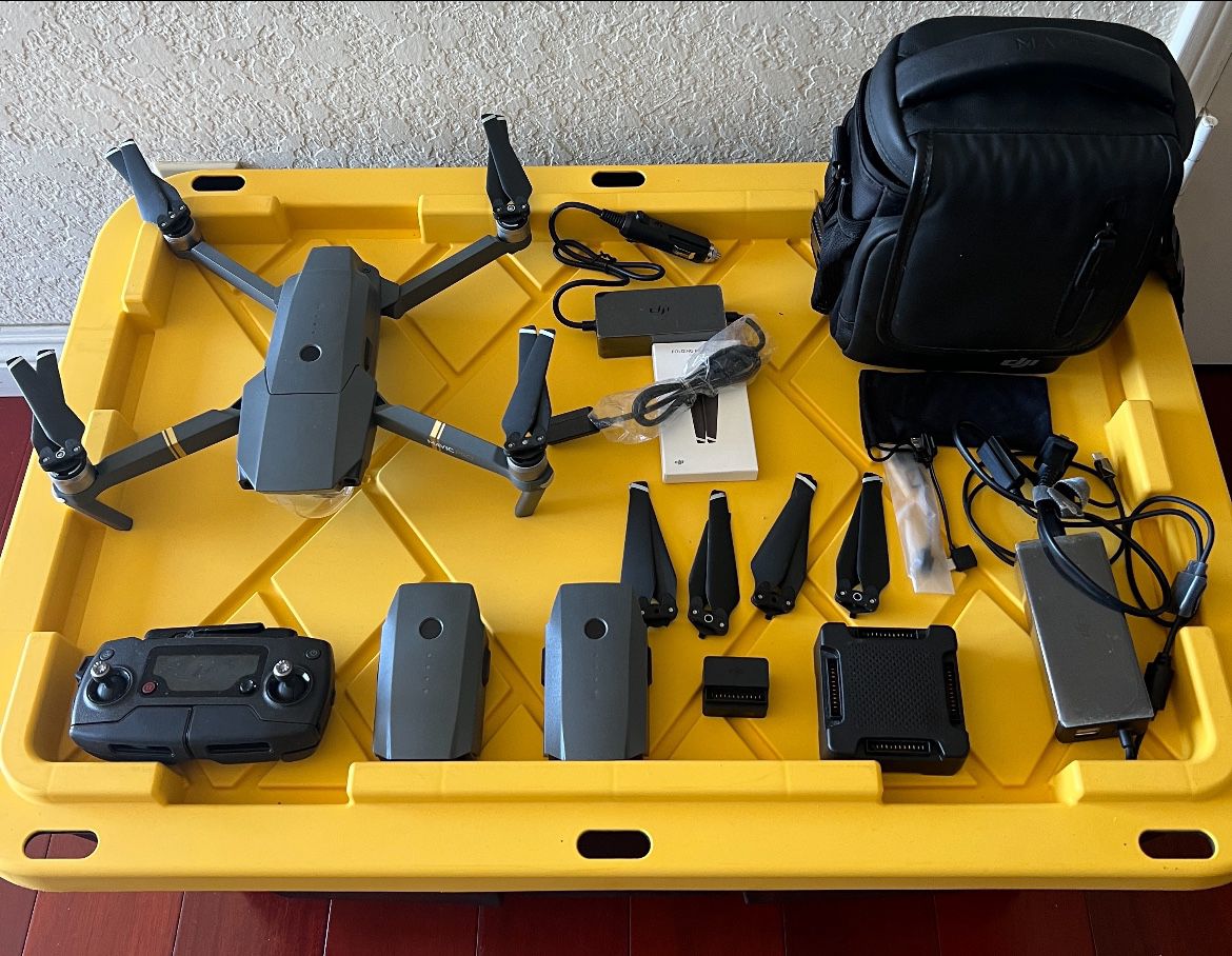 DJI mavic pro with 3 batteries, 4extra propellers, dual usb charging block, 2 extra remote to phone cables, quad charging station, and portable case