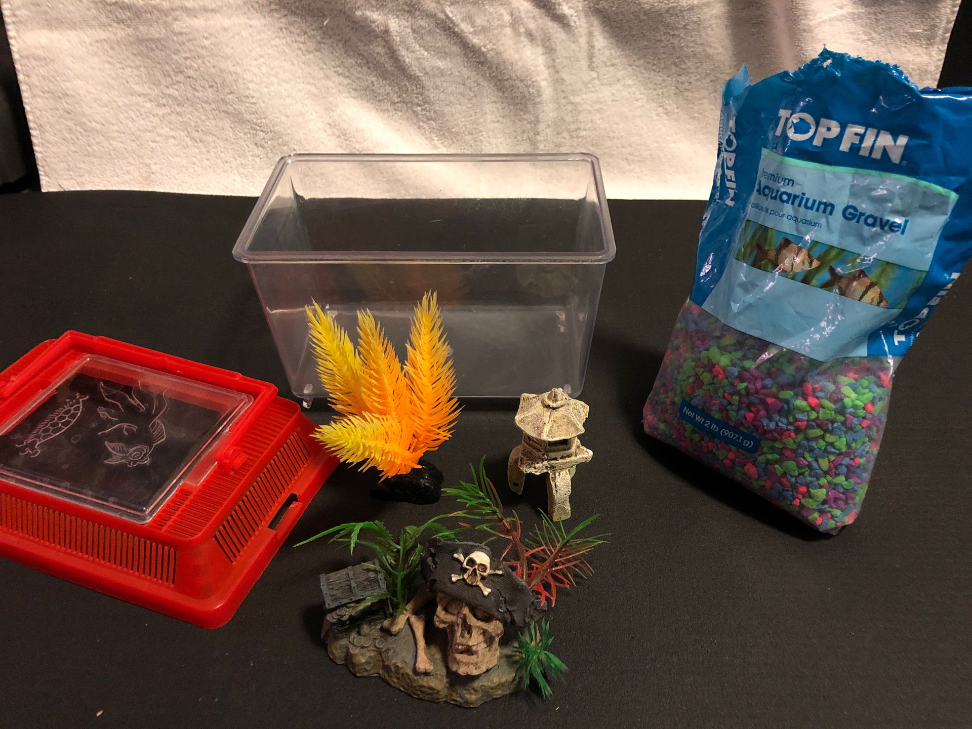 Small Fish Tank with Mulicolor Aquarium Gravel and 3 Decorations (Pirate Skull, Yellow Plastic Plant, Rock Structure)