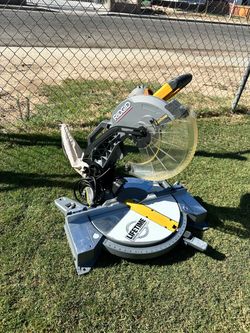 RIDGID Blade not included: 10-inch, 15-amp corded dual-bevel miter saw with LED cut-line indicator.