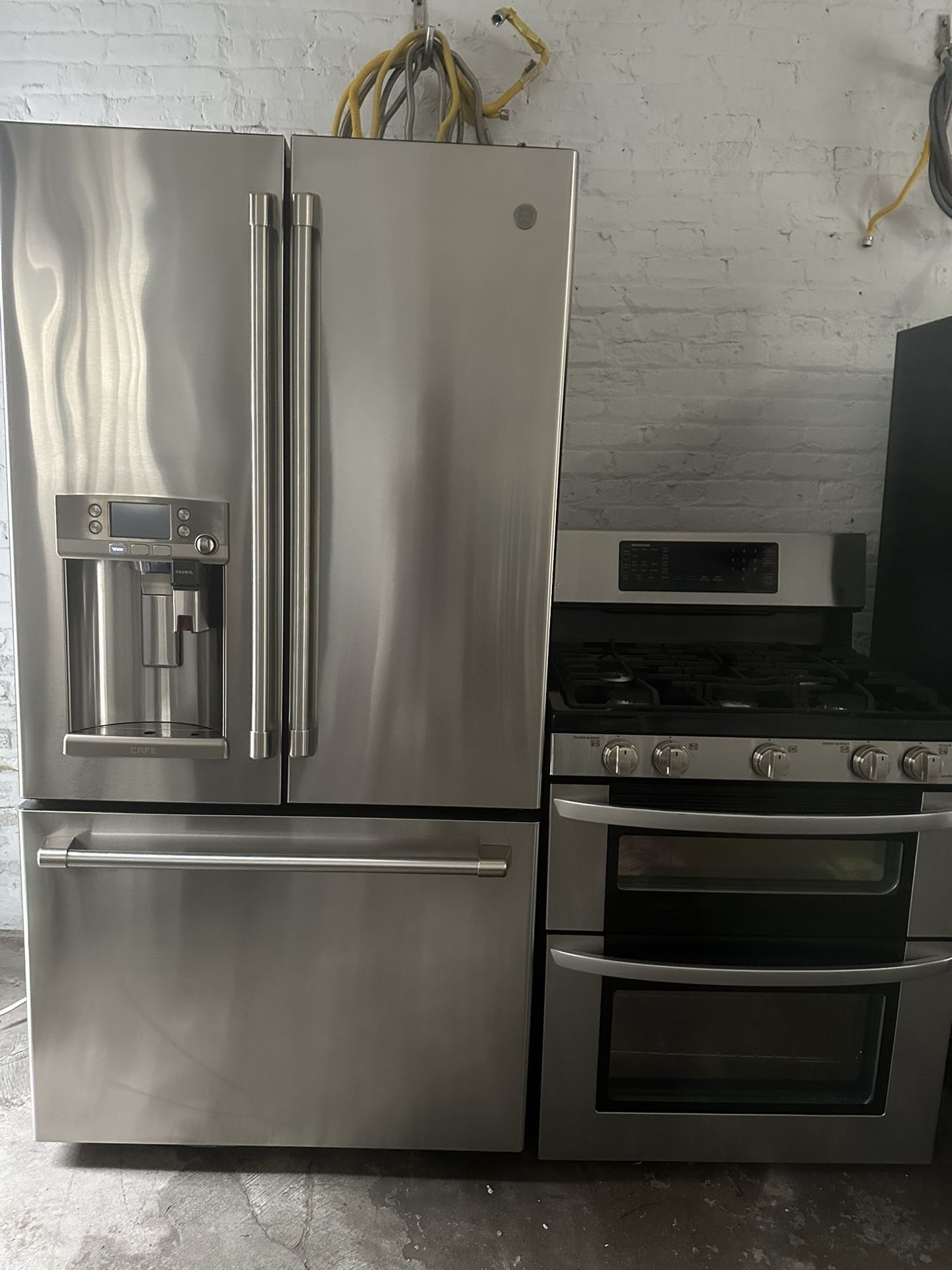 GE Cafe french door refrigerator &. LG double oven gas range set stainless steel