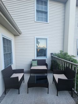 4pc outdoor brown pe wicker patio set beige cushions, pillow, rug, waterproof rattan deck porch furniture
