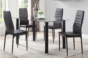 Brand new black dining set. Table and 4 chairs