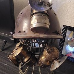 Helmet made of leather that was used by old miners, with three carbide lamps, more than 100 years old.