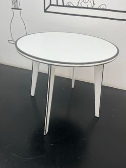 Round White Side Table with Black Outline Detail