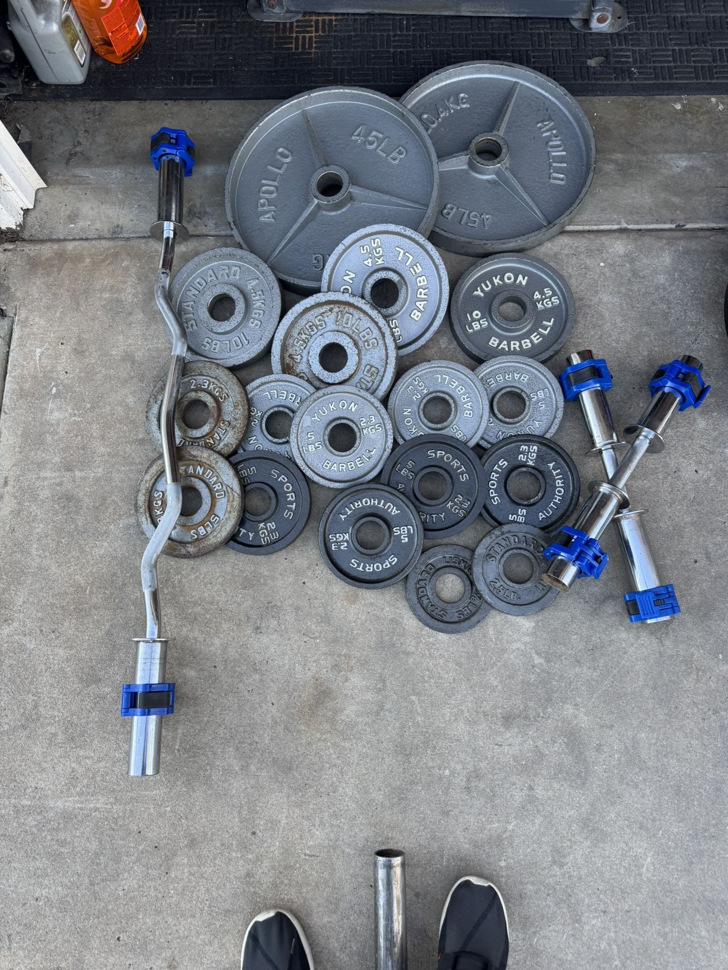 Olympic weights 185lbs total plus curl bar and adjustable dumbbells