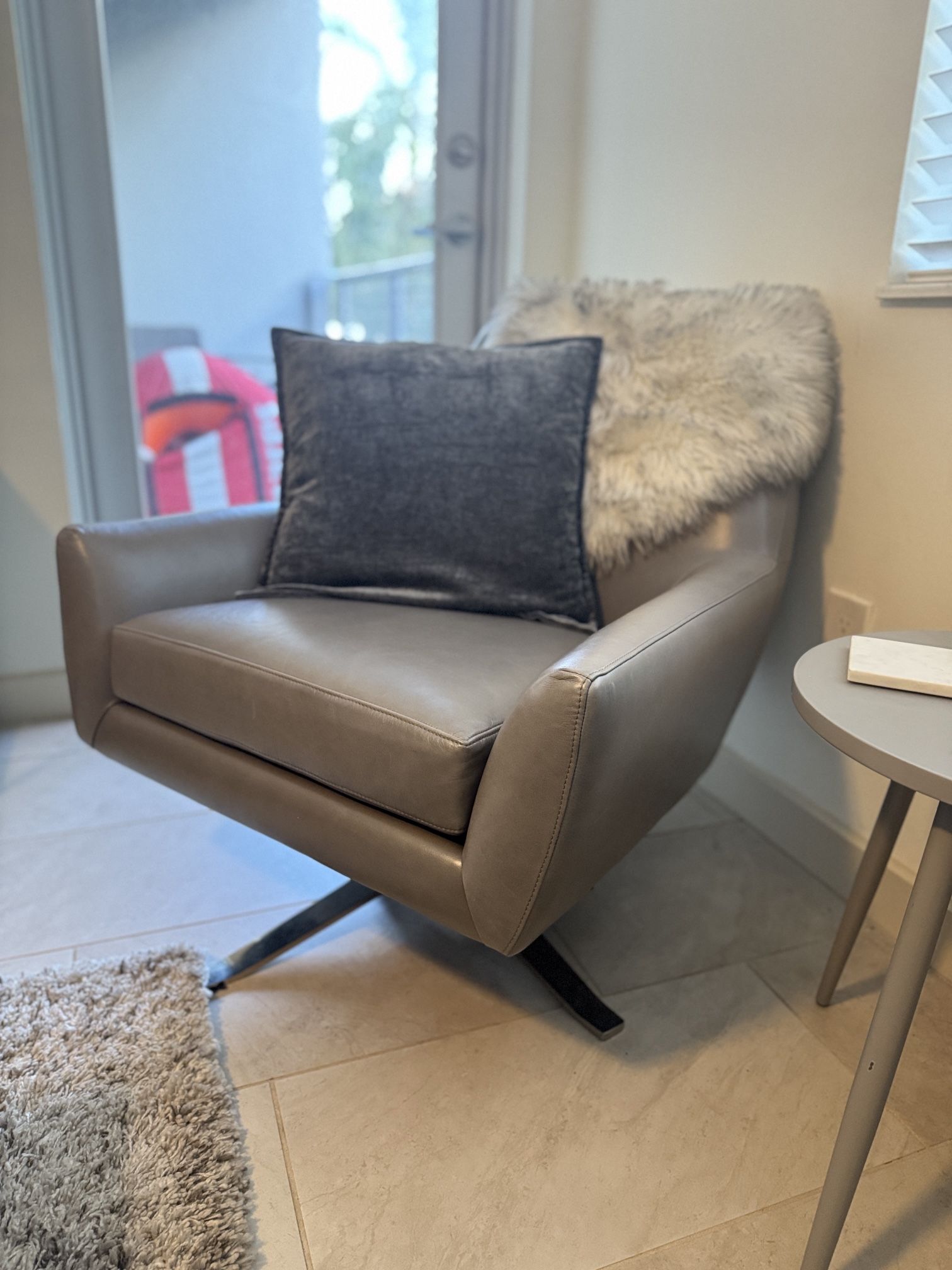 West Elm, leather swivel armchair