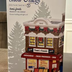 Department 56 - Tom's Food & Carry Out Boy