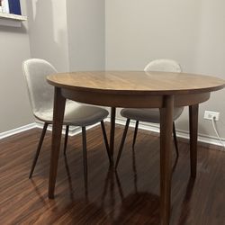 Small Round Dining Table With 2 Beige Linen Chairs 