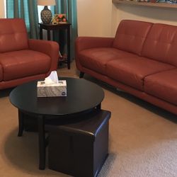 Leather Sofa And Love Seat With Round Coffee Table And Two Ottomans 