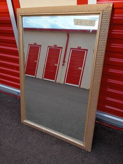 Large gold tone mirror. Measurements are written on the mirror in the picture top right corner