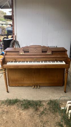 Wurlitzer piano with brass interior