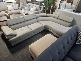 Brand new gray synthetic leather sofa (102" x 85" x 29-34"H)