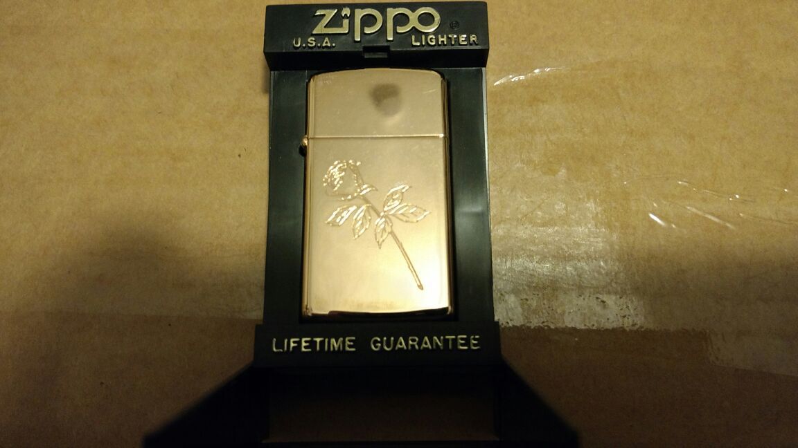 Gold tone rose engraved zippo lighter