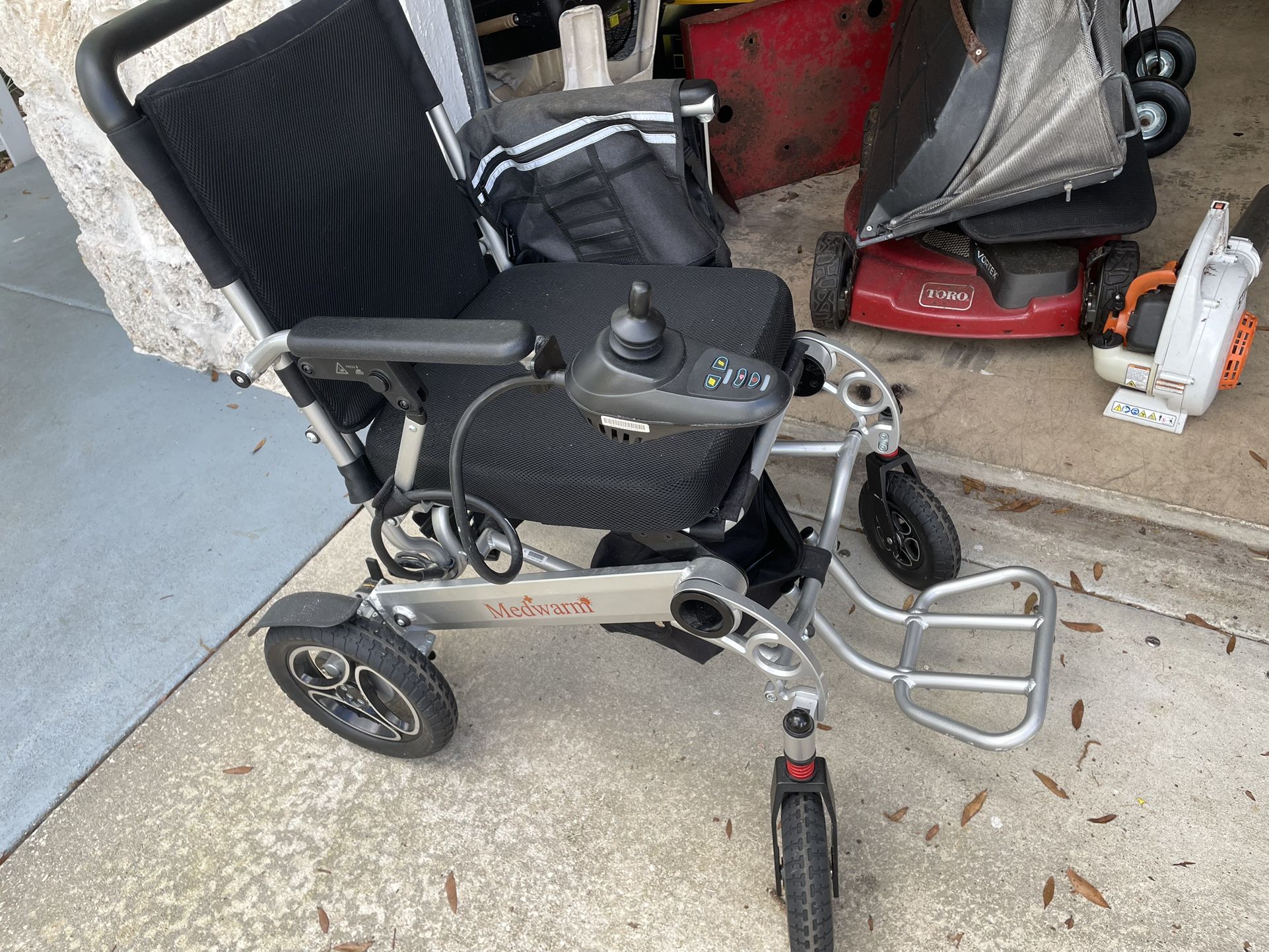 A Medwarm Motorized Chair With Joy Stick