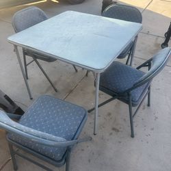 Small Table With 4 Cushion Chairs. 