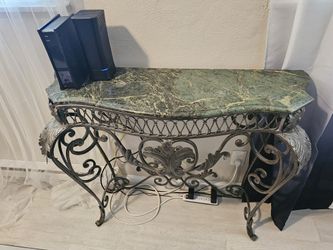 20th century, 
Marble top with iron hornets