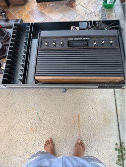 ATARI Model CX-2600  coming with controllers power cable , hard case 51 games