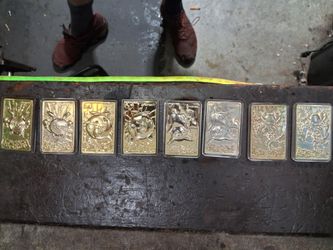 1999 gold plated Pokémon cards and binder full of cards
