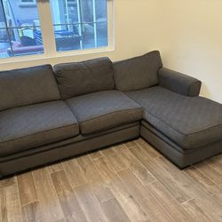 Grey Couch With Chase and Pull Out Mattress