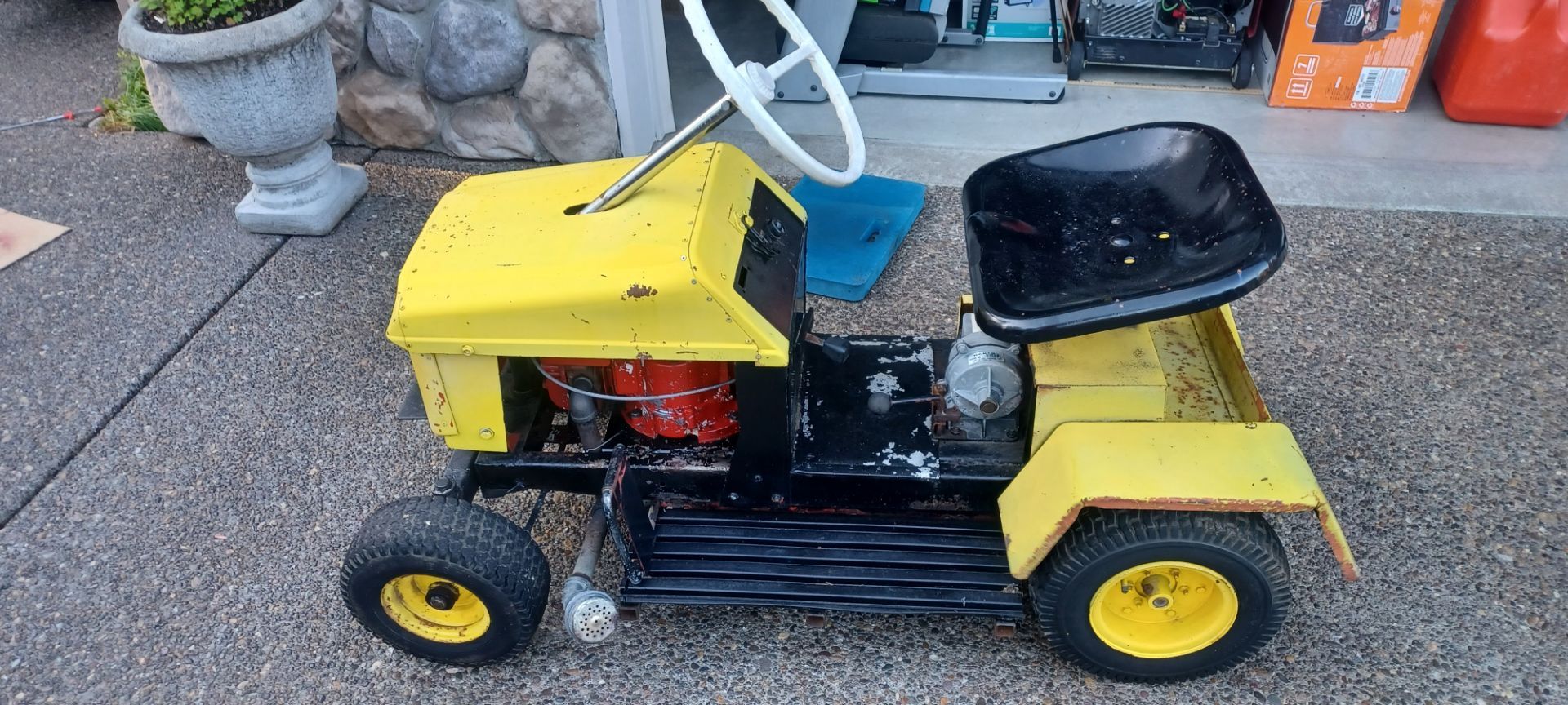Vintage riding lawn mower. Not sure of the make. No deck
