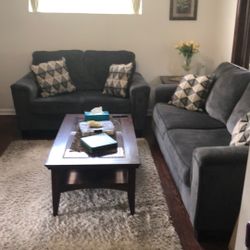 Sofa And Loveseat, With A Set Of Table And A Rug