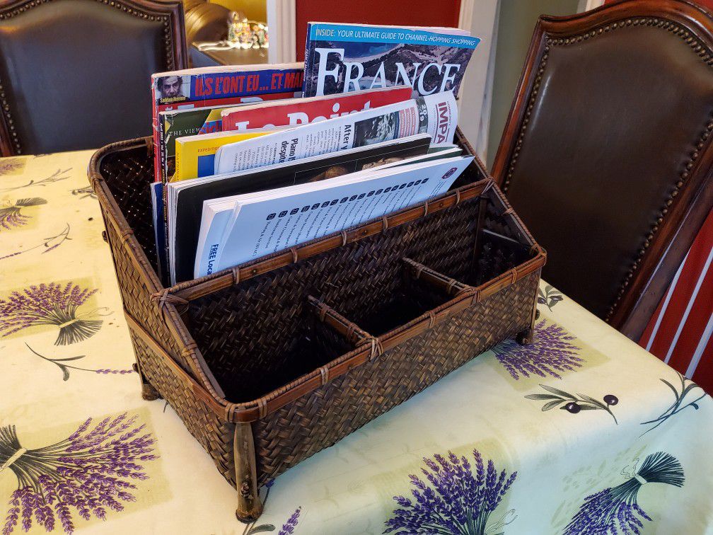 Sturdy wicker magazine rack with slots for remote controls or other things