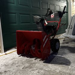Troybilt snowblower 24” 179cc output high voltage 2 stages motor with pull start and electric start.