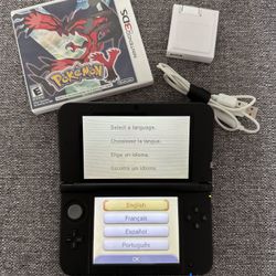 Red Nintendo 3DS XL with Pokémon Y