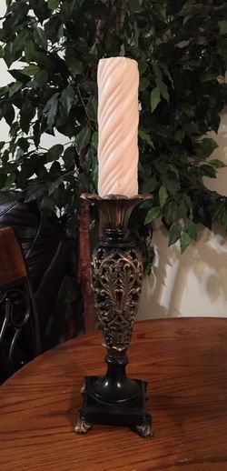 Candle holder with large pillar candle